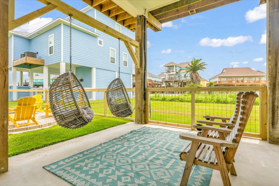 Hanging egg chairs under the house